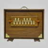 Front view of a 13-key teak wood surpeti drone instrument for Indian classical vocal practice
