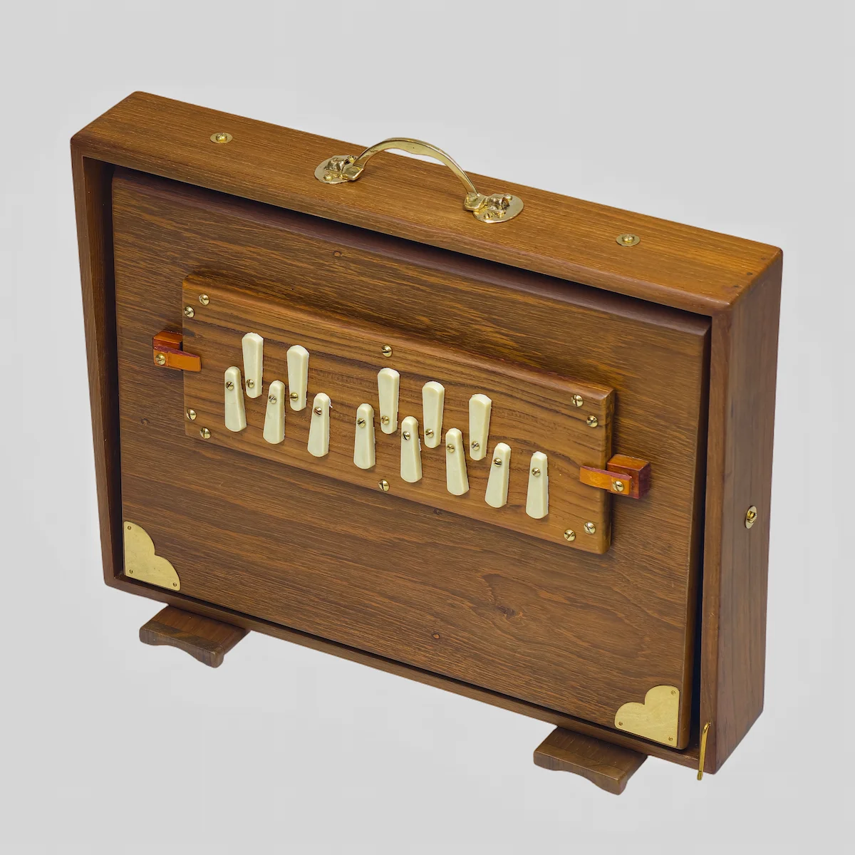 Left profile of an authentic Indian surpeti with fully open blue bellows for long air sustain