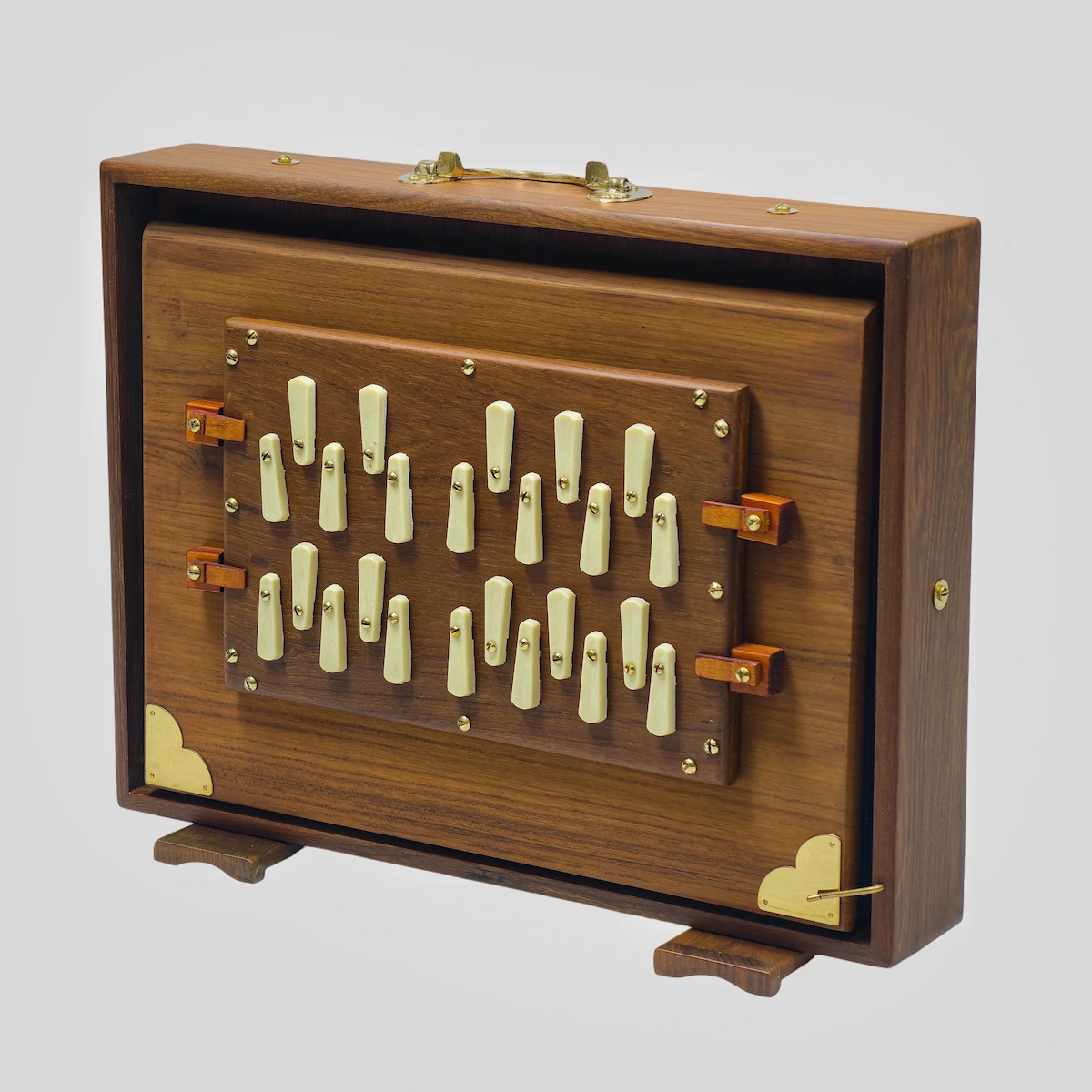 Front view of a National Music teak wood Shruti Box showing 2-octave white keys from C2 to B3