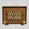 Close-up of the 13 white tuning keys on a 2-octave Indian wooden Shruti Box
