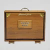 Back side of a wooden Shruti Box showing round sound release holes closed