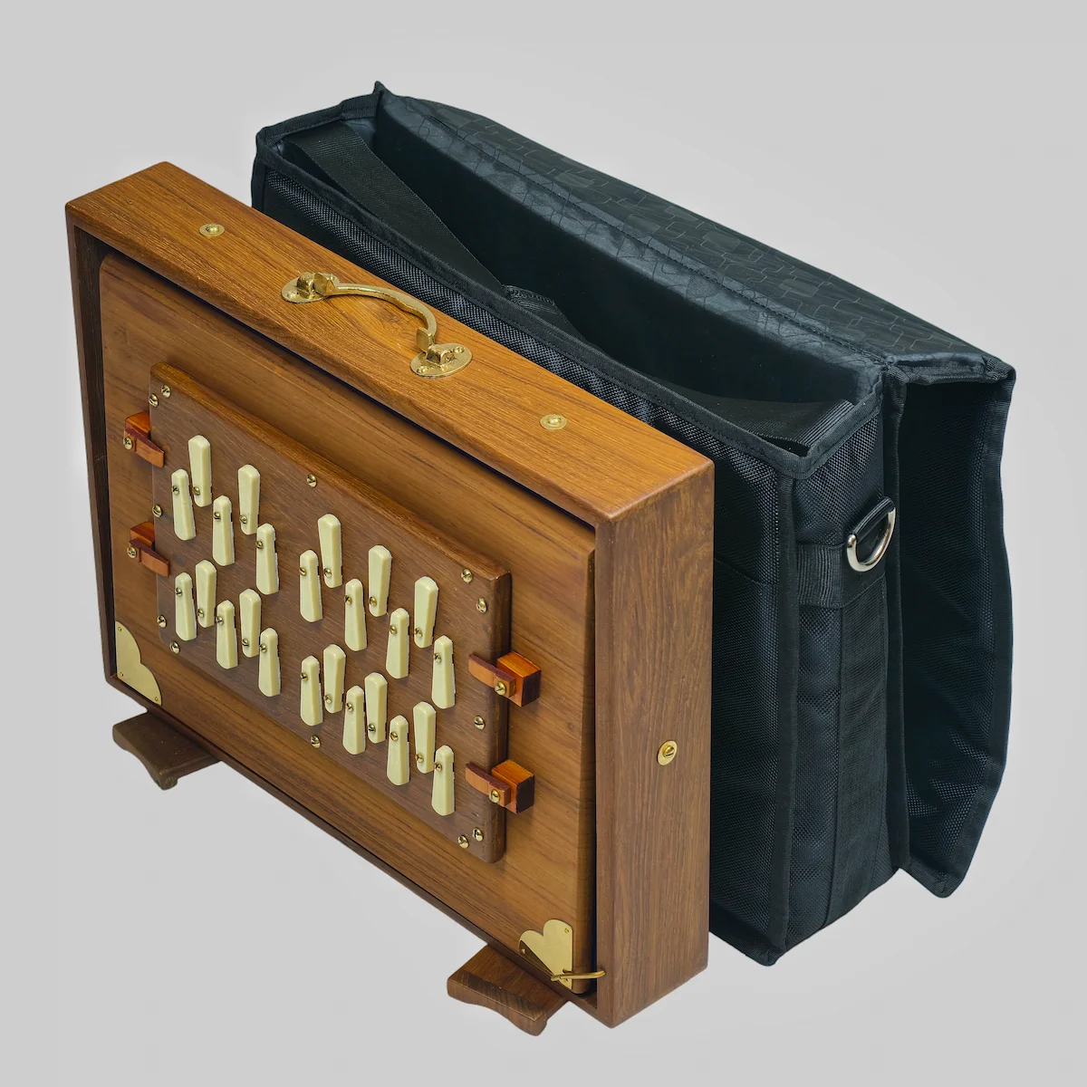 Teak wood Shruti Box sitting next to its included black padded carrying case